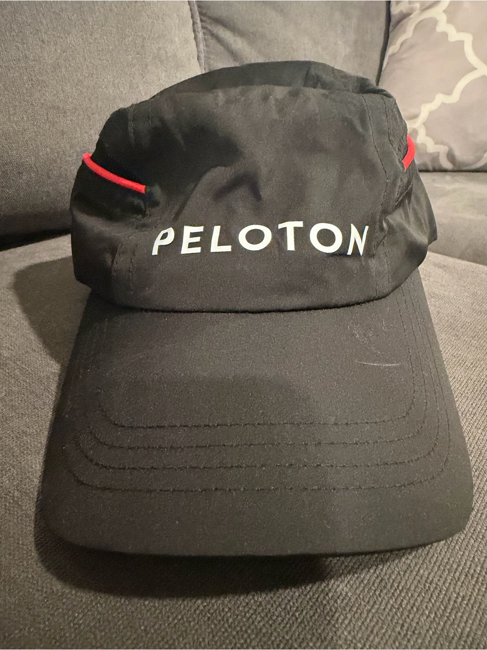 Peloton Black Cap with Red Trim and White Logo